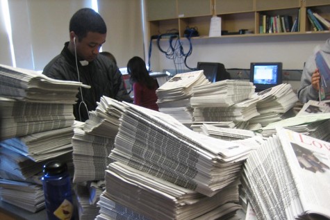 Students prepare to distribute their school newspaper.